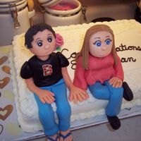 Erica's And Dan's Engagement Cake MMF flowers and characters, buttercream icing.