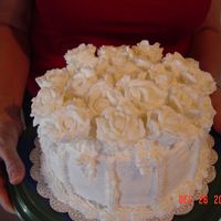 White Roses This is the first cake that I have made after my first class. It is a sour cream pound cake with almond butter cream icing. Filling is...