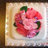Simple_Flower_Cake.jpg Wanted to keep it simple, small fruit cake covered in fondant, I hand made the roses too. they were much harder than i thought but turned...