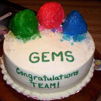 Gems Cake carrot cake with cream cheese frosting. I used edible glitter on the small cakes on top and rock candy around them.