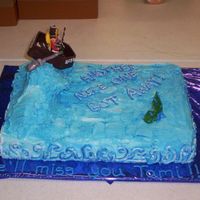 100_0365.jpg this is actually a going away cake... the boat is all chocolate and the little person is made of tootsie rolls