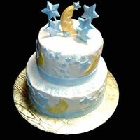 A Star Is Born Iced in buttercream with fondant moons, stars and ribbon. Topped with white chocolate moon and stars. All decorations dusted with pearl...
