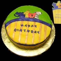 Zoo Cake made to look like the party invite. Iced in buttercream with fondant animals and stripes.