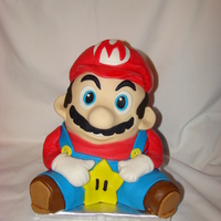 Mario This cake is chocolate fudge w/ bc and covered in mmf. I made the cake in the 3D stand up bear pan. I cut off the bear ears and the legs. I...