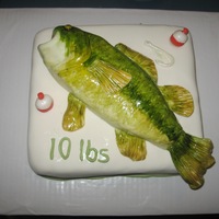 Large Mouth Bass Chocolate fudge cake, buttercream icing, and fondant. Fish is molded around small piece of cake and hand painted for a wet look.