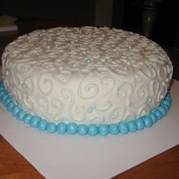 Swirl Cake Practice cake. Spice cake covered with buttercream icing and fondant.