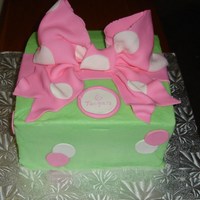 Polka Dot Buttercream with fondant bow.