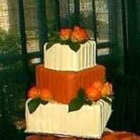 Bridal_Show_Cake_Cropped.jpg Fondant covered styro cake. Real flowers & leaves. This was a "dummy cake" at a bridal show I participated in erlier this...