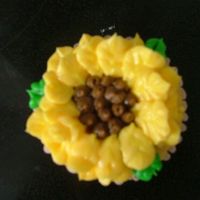 Sunflower Cupcake The sunflower petals were done in buttercream with a leaf tip.