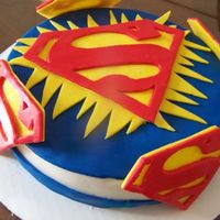 Superman Cheesecake i made sure the cheesecake was extra firm before covering it w/ fondant