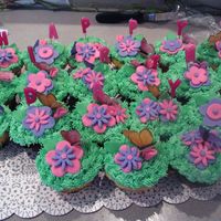 Butterflies & Flower Cupcakes I made these to go along with the Sun & Flowers first birthday cake I posted a few days ago. The flowers are Marshmallow fondant and...