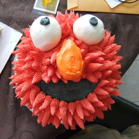 Elmo Smash Cake Just a 6" cake with buttercream & fondant eyes...I think Elmo looks a wee bit possessed lol!
