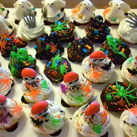 House Warming - Halloween Cupcakes Pictured are 3 dozen mixed cupcakes (strawberry, classic vanilla, fudge-type/dark chocolate) cupcakes for a friend's house warming a...
