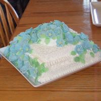 Morning Glories This is a basic white cake with lemon filling and buttercream frosting. The morning glories were my fist attempt with gum paste.