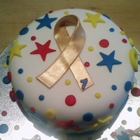 Logan's Celebration Cake For a young boy who is celebrating 1 year cancer free! Gold is the color for childhood cancer(s) support ribbons.