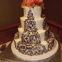 Ditalia Wedding Three tiers of real cake, bottom tier styrofoam. Replicated a design/image bride brought to me, so I have no way of knowing who original...