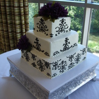 Damask Cake For Kidd Wedding Hand piped damask desing on square cake with lapis colored silk flowers provided by bride.