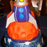 Rocket Ship Birthday Cake This is the rocket ship cake I did for my son's 4th Birthday party. The base is a vanilla butter cake, the middle "planet"...