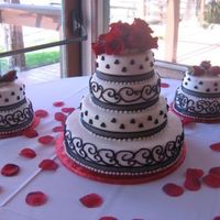 Black And White Wedding This was my first wedding cake. It was for my sister's wedding, with black, white and red as the colors.