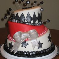 Topsy Turvy Black, White And Red This cake was for my sister's bridal shower. Her colors were black, white and red. I also used a pearl luster dust to add shimmer.