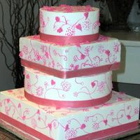 Pink Vines And Leaves Copied this from a brides' picture. Everything done in buttercream except ribbon. I learned something from this cake about stacking...