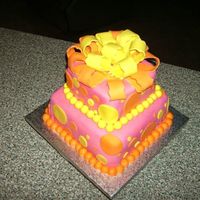 Polka Dot Fondant White with raspberry filling, buttercream covered with fondant and fondant accents. Custom made for a high school homecoming queen's...