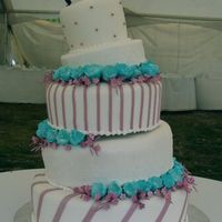 Touch Of Whimsy 5 tier rolled fondant cake with gumpaste flowers and mauve accents