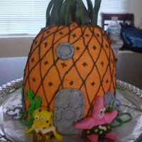 Spongebob Cake I made this cake for a picnic party. The cake is layered then shaped. Covered with buttercream icing. Decorations are made out of MMF