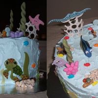 Nemo And Gang NEMO birthday cake. All is edible except for nemo and dory. All characters made of fondant (used edible marker). Rocks/fish are candy.