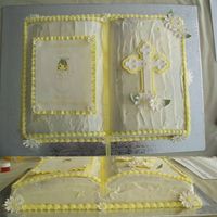 Communion Cake Carrot cake with Cream Cheese Icing. All flowers, cross, and picture ruffle was made out of gumpaste. The picture is an edible image.