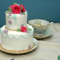 D'arcy's Little Birthday Cake This is a tiny cake for my daughter's 9th birthday. It's a 4 inch and a 2 1/2 inch chocolate mud cake, covered in fondant with...