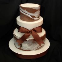 Marbled Chocolate Fondant This is from a Martha Stewart design. I love the simplicity and elegance of this cake, although simple looking it was quite difficult to...