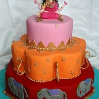 Bollywood Birthday Cake This is a caramel mud and two tiers of white coconut mud cake(both Boonenati's recipes) covered in ganache and Fondx. The Lakshmi on...