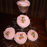 Teddies Cupcakes Vanila cupcake filled with raspberry ganache and covered with raspberry buttercream. teddy made of sugar.