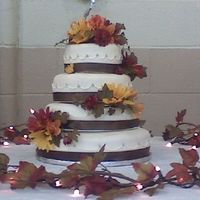 Bobby's Wedding Cake This was my 1st wedding cake i did for my cousins wedding this last weekend. i am really happy with how it came out. covered in fondant,...