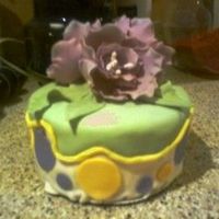 Bridal Topper just the topper of the cake...fant. flower in purple, white fondant, with colored fond. saw the color scheme on anther cake and i just...