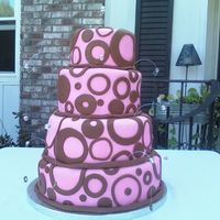 Pop Wedding the bride and i saw this cake on duffs website and she wanted one just like it. but only in pink and brown. fondant covered. and hanging...