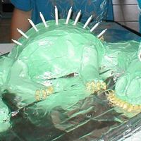 Dragon Cake This was my first sculpted cake. I used...sigh...canned frosting. Now having worked with homemade buttercream I am NEVER going back! I saw...