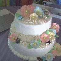 Seashells Buttercream icing with gumpaste flowers, chocolate sea shells and candy stones