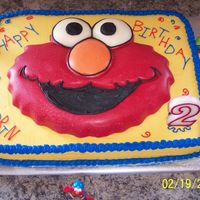 Elmo Birthday Cake Elmo is actually made with candy melts, not cake. I used the Elmo shape pan, filled it in stages, and supported it with a cut-out cake...