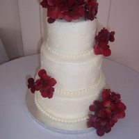 First Tiered Cake! My first ever tiered cake for my sister's bridal shower. Buttercream with silk flowers.