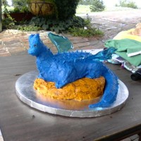 Saphira "the Blue Dragon" This made using buttercreme. I bent thin wire to hold the shape of the wings, then put blue gelatin in wire to make blue wings.