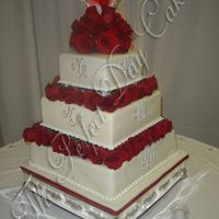 Natalie White chocolate cake with strawberry filling. Decorated in fondant and the monogram was hand painted with silver luster dust. Oh, and the...