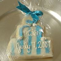 Msb Blue and white wedding cookie. Matched their wedding cake until I ended up going to drop off the cake and they placed roses on them. Sure,...