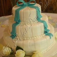 Melissa White Cake with Bavarian Cream filling. Fondant accents. They also had cookie favors to give out that I made. You can see them in my photo...
