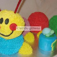 Caterpillar Baby Einstein cake for my cousin's first birthday. The blue and yellow balls are made of rice krispies while the other three are cake...