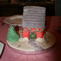 Holiday House Chocolate cake with fondant decorations. I made the mistake of surprising my parents with it, but not staying to eat it. They're still...