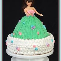 Luau Girl Cake My sisters daughters first Birthday Party, Luau Theme, she wanted a luau girl and I put her on two 9inch round cakes.Luau girl decorated in...