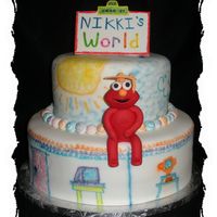 Nikki's World This was for a graduation party. When the grad was a kid she loved Elmo. This is a 12" and 8" cake. Elmo is made out of gumpaste...