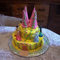Yellow Princess Castle Cake made for my daughters 4th birthday. She wanted a pink and yellow castle